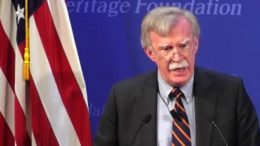 Bolton speaks at Heritage Foundation. Photo credit to The Freedom Times compilation with The Heritage Foundation Screen Shot.